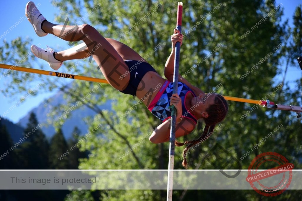 Noelle Puchinger clears the pole vault bar.