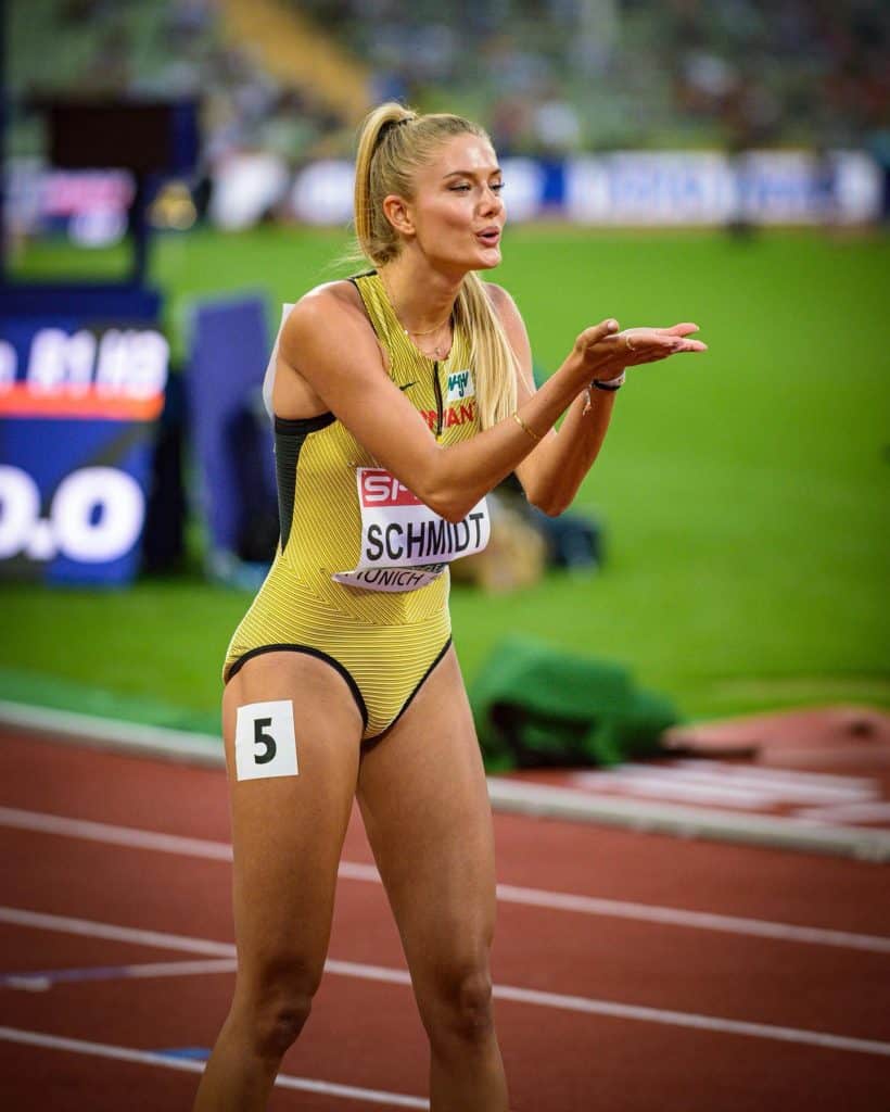 Alicia Schmidt on the track, blowing a kiss to someone