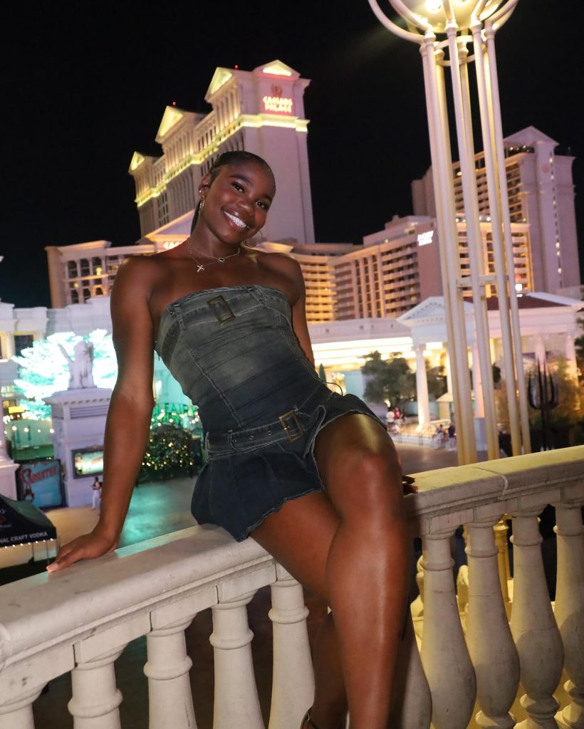 Colleen in an eveningwear dress, posing in Las Vegas.