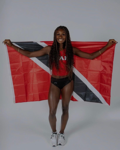 Lisa Raye holding the Trinidad & Tobago flag