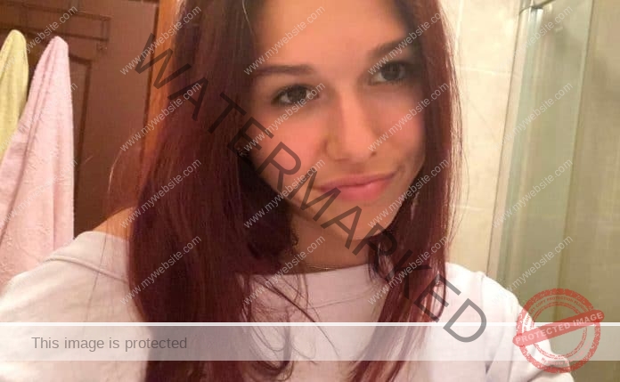 Angelina Topic smirking to the camera in a selfie.