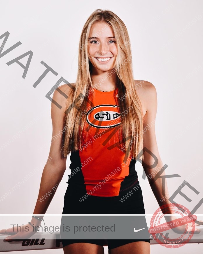 Shelby Romig posing in her media photos in her St. Cloud State track uniform