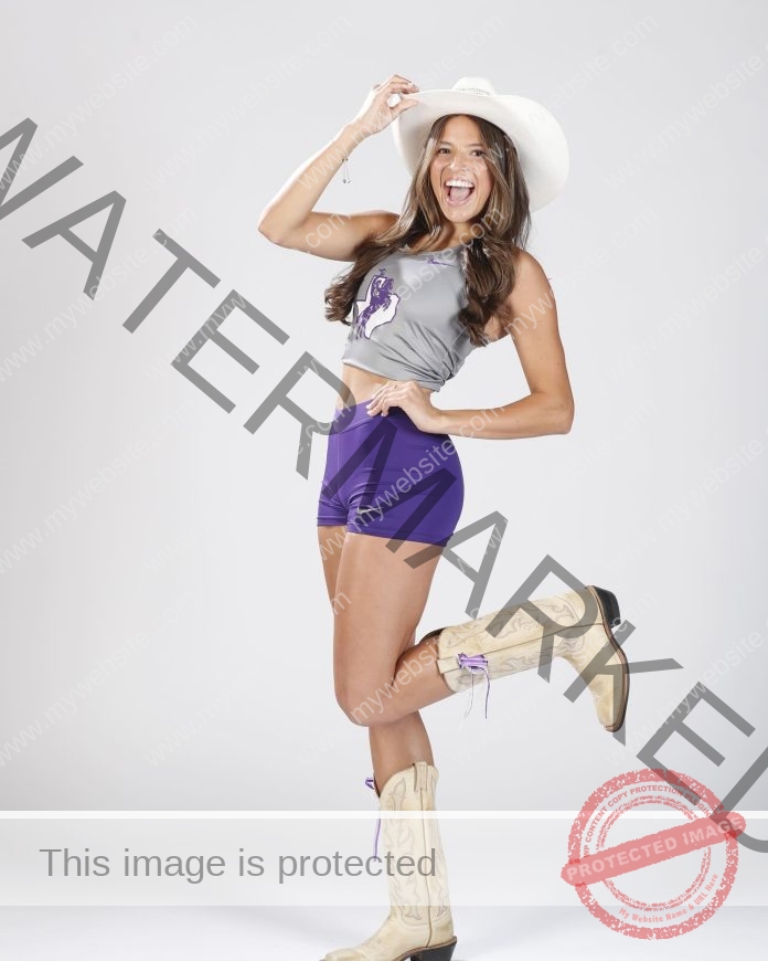 Sofia DeGroot poses in her Tarleton State University track uniform and a cowboy hat.
