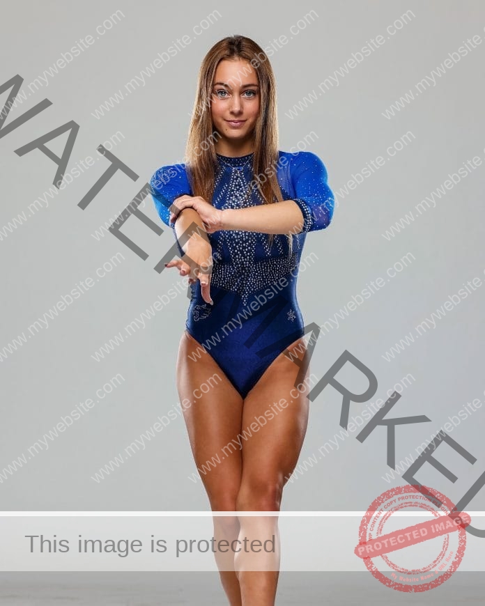 Alyssa Orgen in a media day photo wearing her blue Florida Gators gymnastics leo