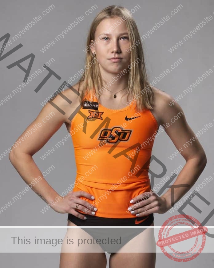 Saara Hakanen poses in her Oklahoma State track uniform, hands on hips.