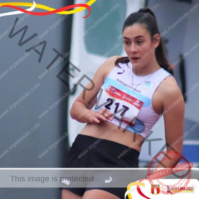 Abril Okon preparing for a jump at a tack meet, staring intently and wearing number 217.