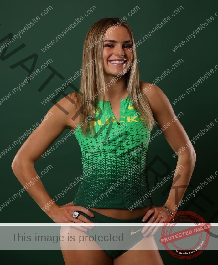 Ella Clayton posing for her media photo in her Oregon Ducks uniform