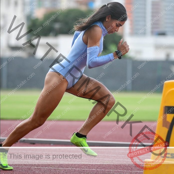 Ibeyis Romero in a periwinkle bodysuit on the track
