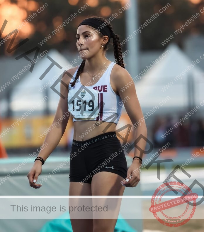 Miriam Sánchez looking focused at the track, wearing her track uniform from Mexico.