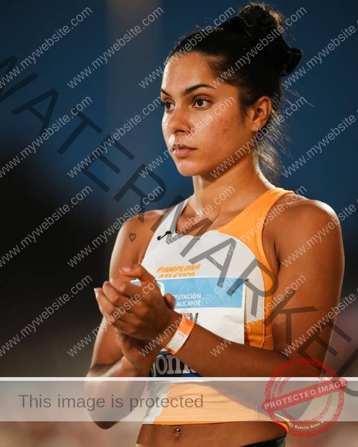 Laila Lacuey of Spain preparing for a track event, wearing her track uniform and a focused face.
