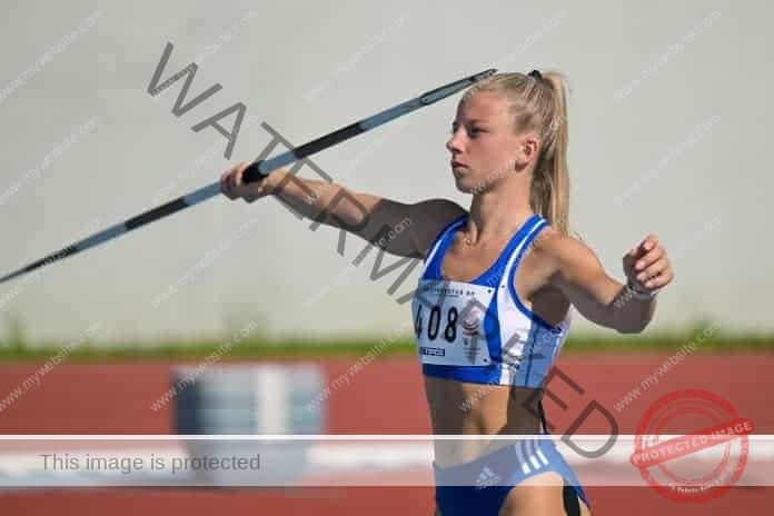 Laura Frličková prepares to throw the javelin on the track.