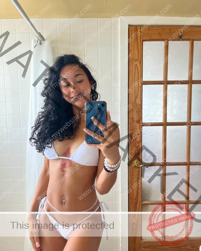 Yasmeen Tinsley poses in a white string bikini