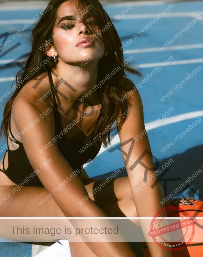 Sofi Santoyo in a black bodysuit, posing on the track