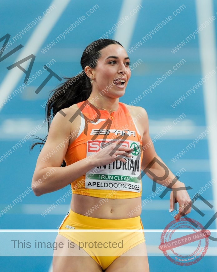 Eva Santidrian runs with determination on the track, representing Spain as a dedicated track and field athlete.