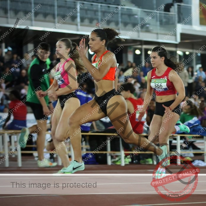 Spanish gymnast Jazmin Romeu performs advanced flexibility pose during competition.