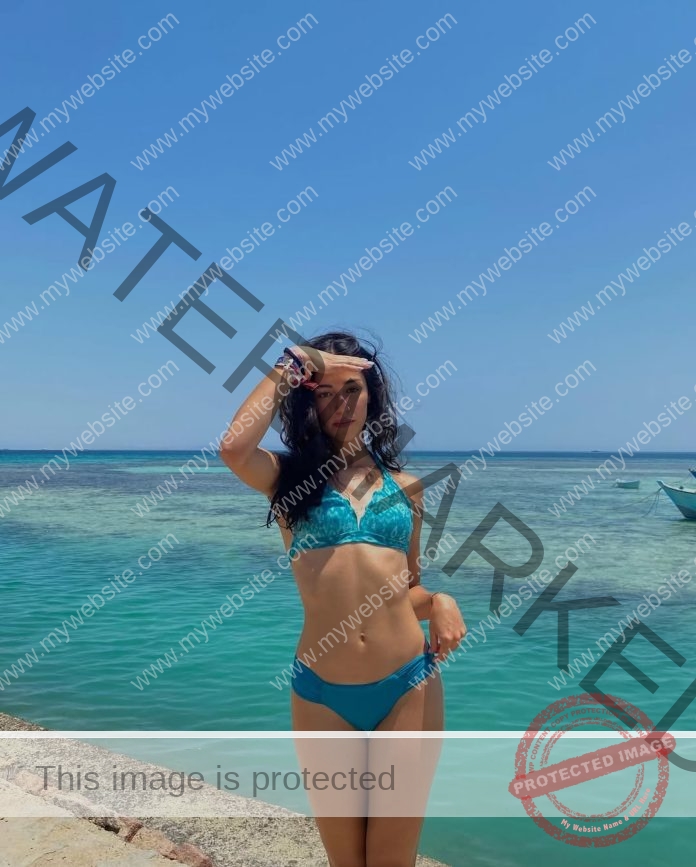 Aroa Carballo in an aqua bikini at the beach