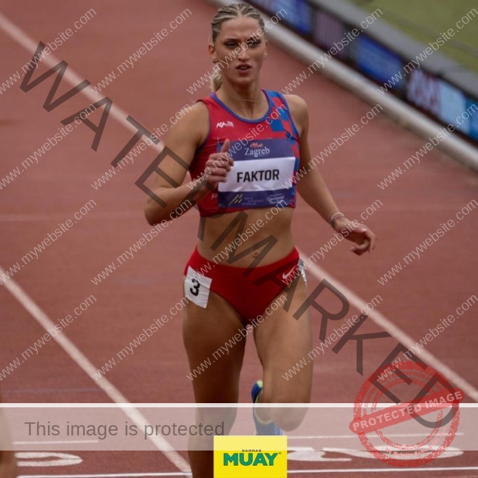Croatian hurdler Lorena Faktor competing in 100m hurdles wearing national team uniform.