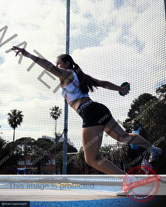 Pilar Fernandez spins powerfully during discus throw competition for Uruguay U18 team.