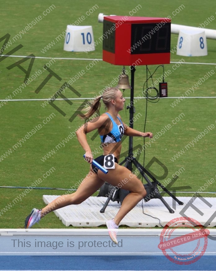 Australian athlete Ella Randazzo in green and gold uniform preparing for track competition