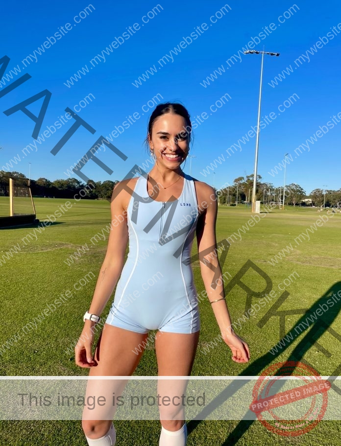 Australian fitness influencer Imogen Russell poses in athletic wear, displaying her toned physique.