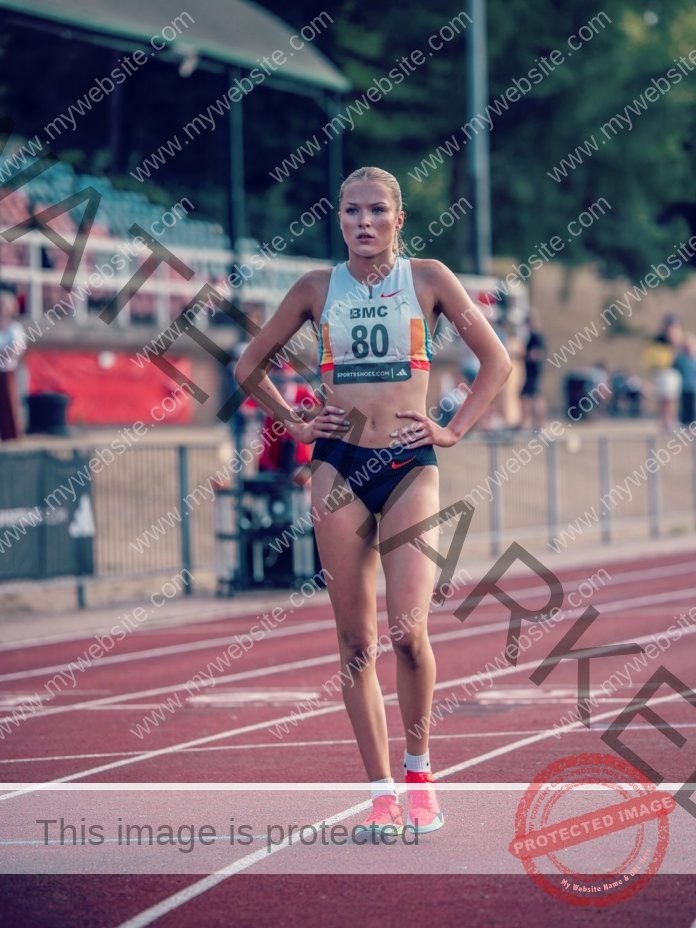 Shaikira King standing on track wearing bib number 60 during athletic competition.