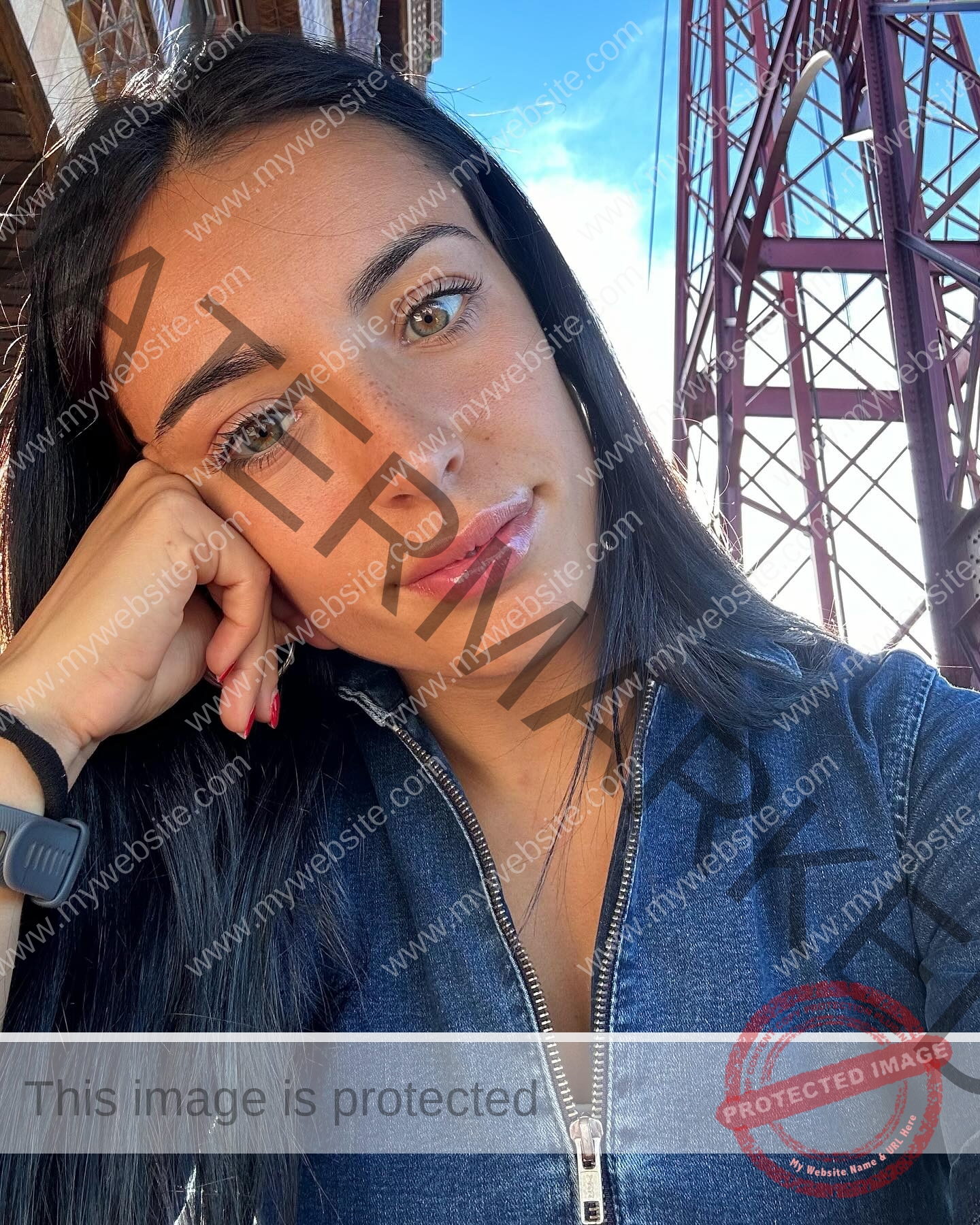 ainhoa-idoiaga-spain-ainhoidoiaga-00365 Ainhoa Idoiaga, track athlete from Spain, with long dark hair in a denim top rests her head on her hand and looks at the camera.