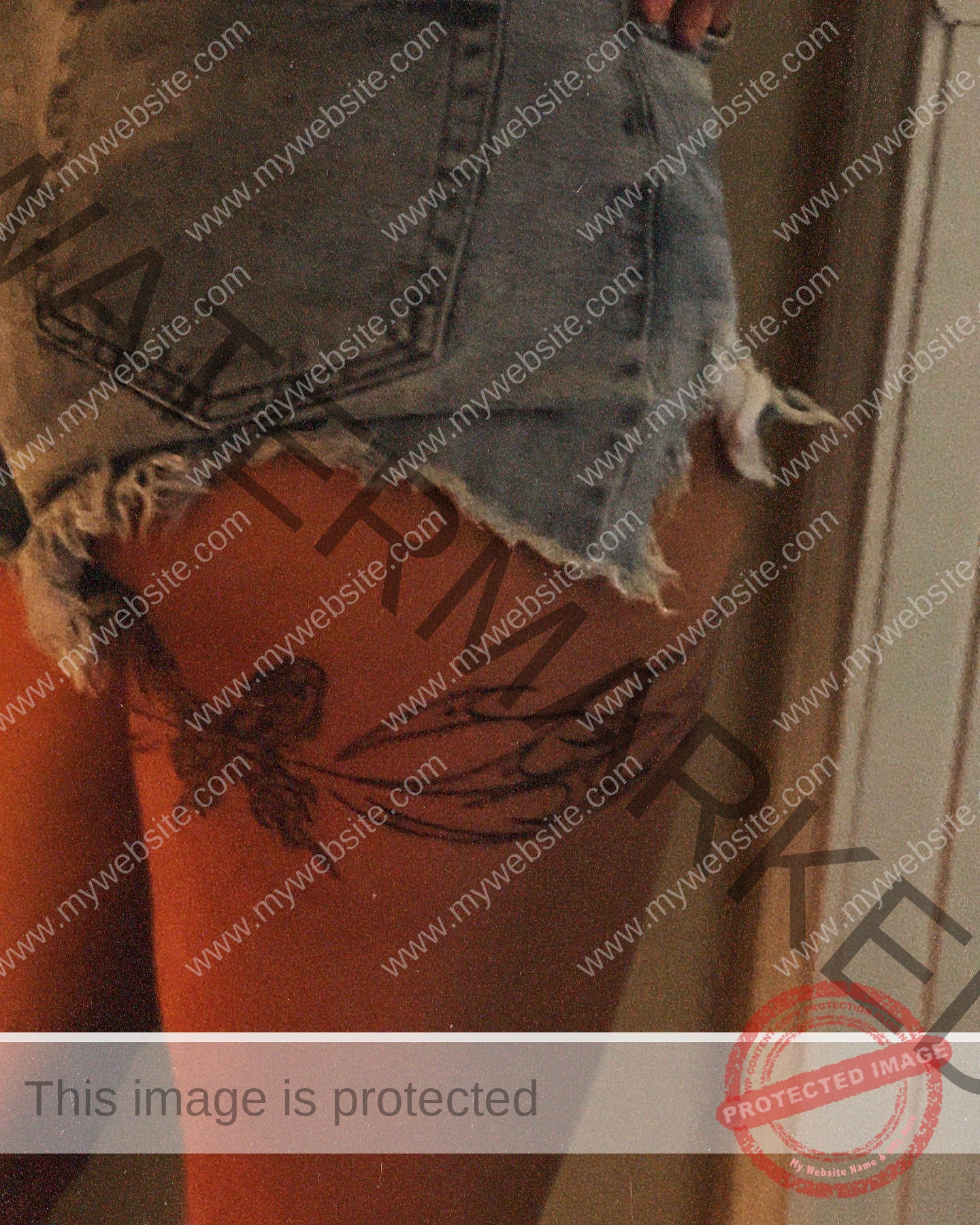 alondra-ortiz-costa-rica-alortizroman-529 Alondra Ortiz Swimmer Alondra Ortiz wears frayed denim shorts, showing a dragonfly and floral tattoo on her upper thigh.