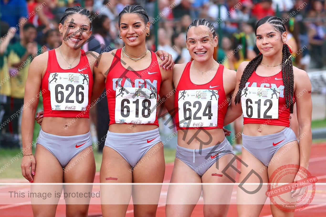 andrea-rivera-aviles-puerto-rico-aandrea.sofiaa-05930 Andrea Rivera Aviles, track athlete from Puerto Rico, stands on a track with three teammates in red sports bras, smiling at the camera.
