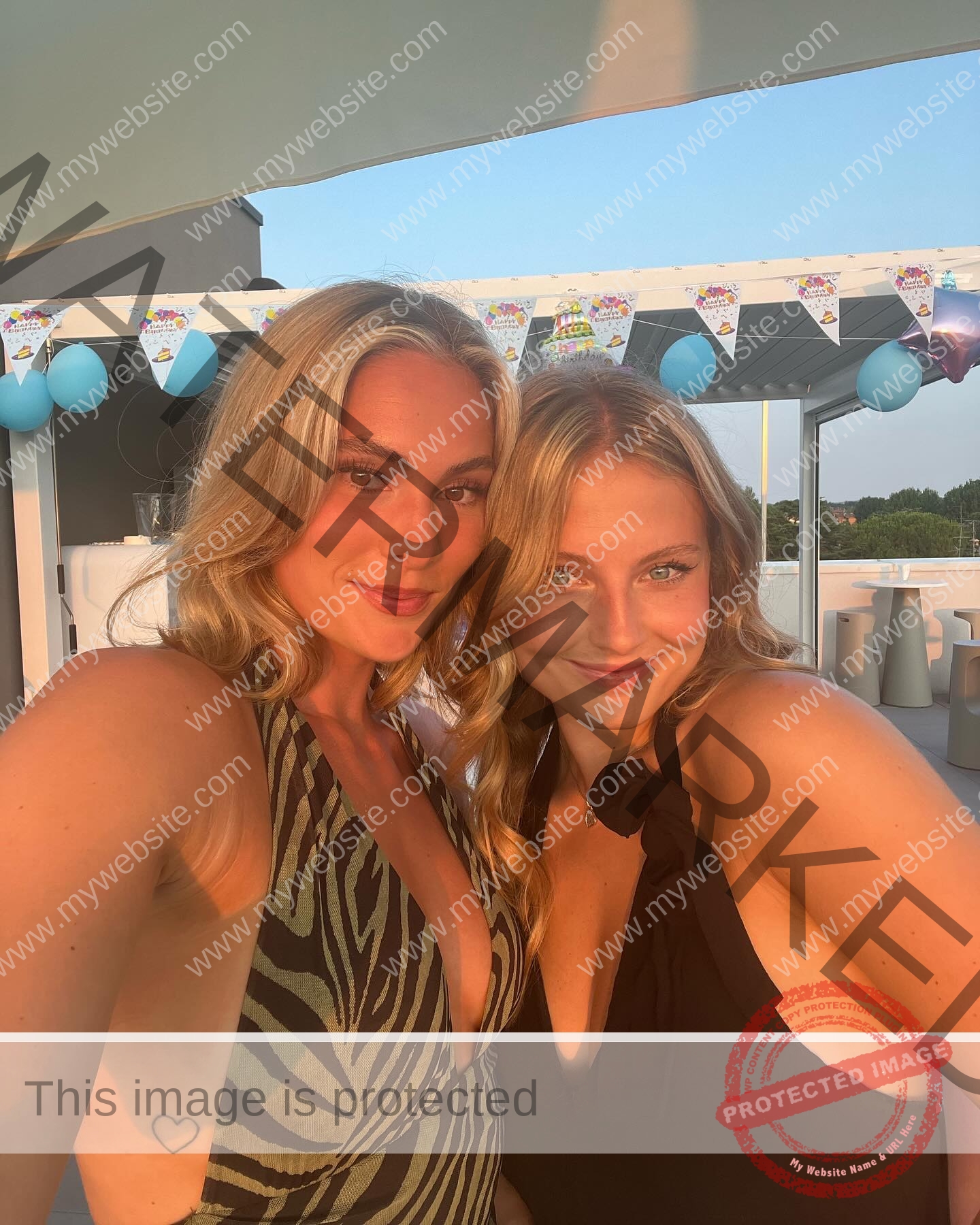 birna-kristjansdottir-iceland-birnakristink-10979 Birna-Kristjansdottir, track athlete from Iceland, and another young woman with long blonde hair smile, taking a selfie at a festive party.