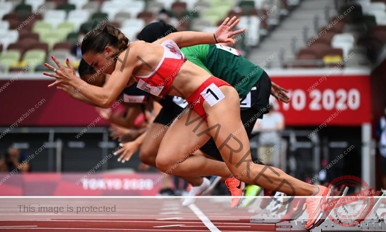 carla-scicluna-malta-carla.scicluna-01658 Carla Scicluna, track athlete from Malta, and others start a sprint at Tokyo 2020, launching off the starting blocks on track.
