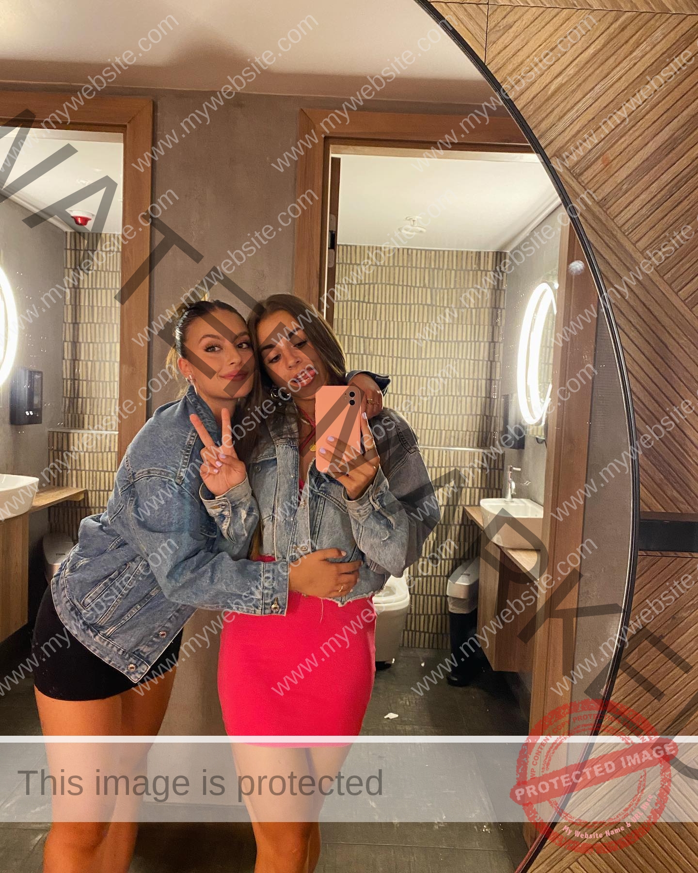 carla-scicluna-malta-carla.scicluna-01714 Carla Scicluna, track athlete from Malta, poses with another woman for a mirror selfie; both wear denim jackets and smile.