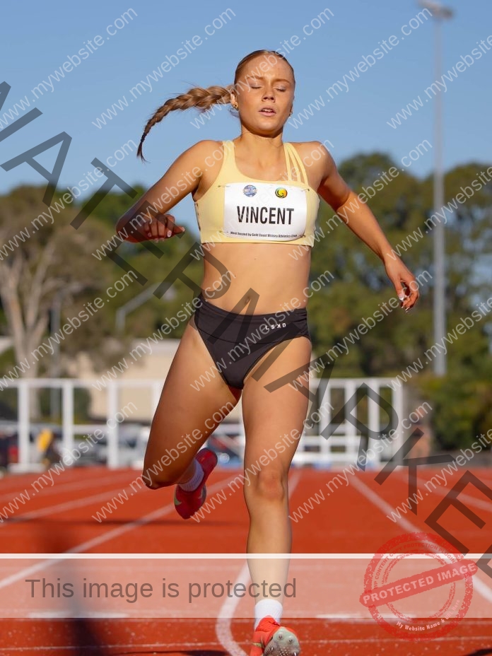 Charlee Vincent Charlee Vincent, a track and field athlete from Australia with a braid, in yellow top and black shorts, finishes a race eyes closed.