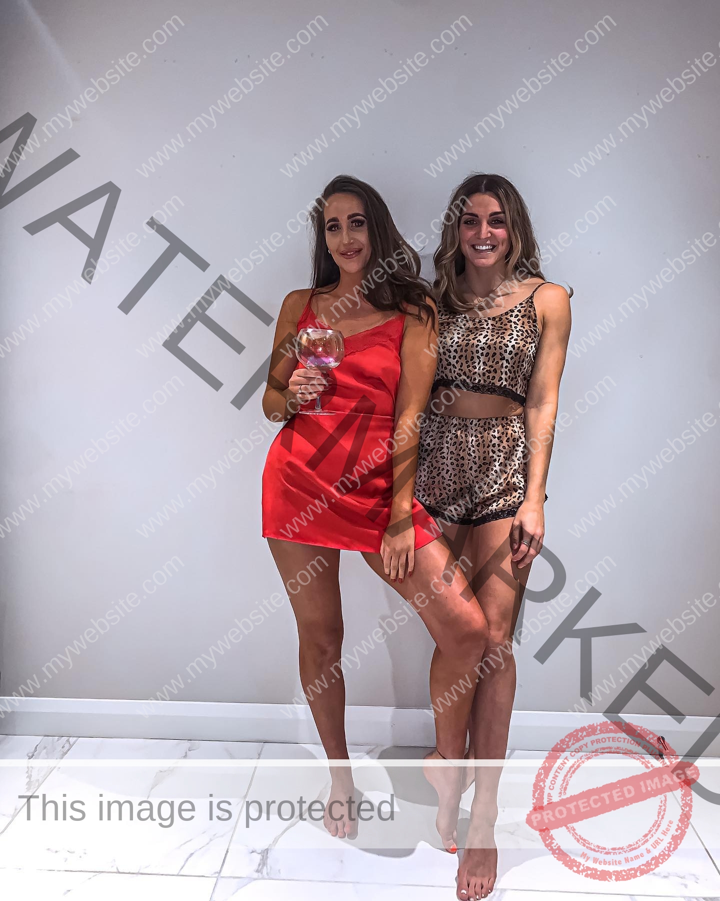 charlotte-wingfield-malta-charlottewingfield.oly-03711 Charlotte Wingfield, track athlete from Malta, stands indoors with another woman; both smile barefoot, wearing chic dresses.