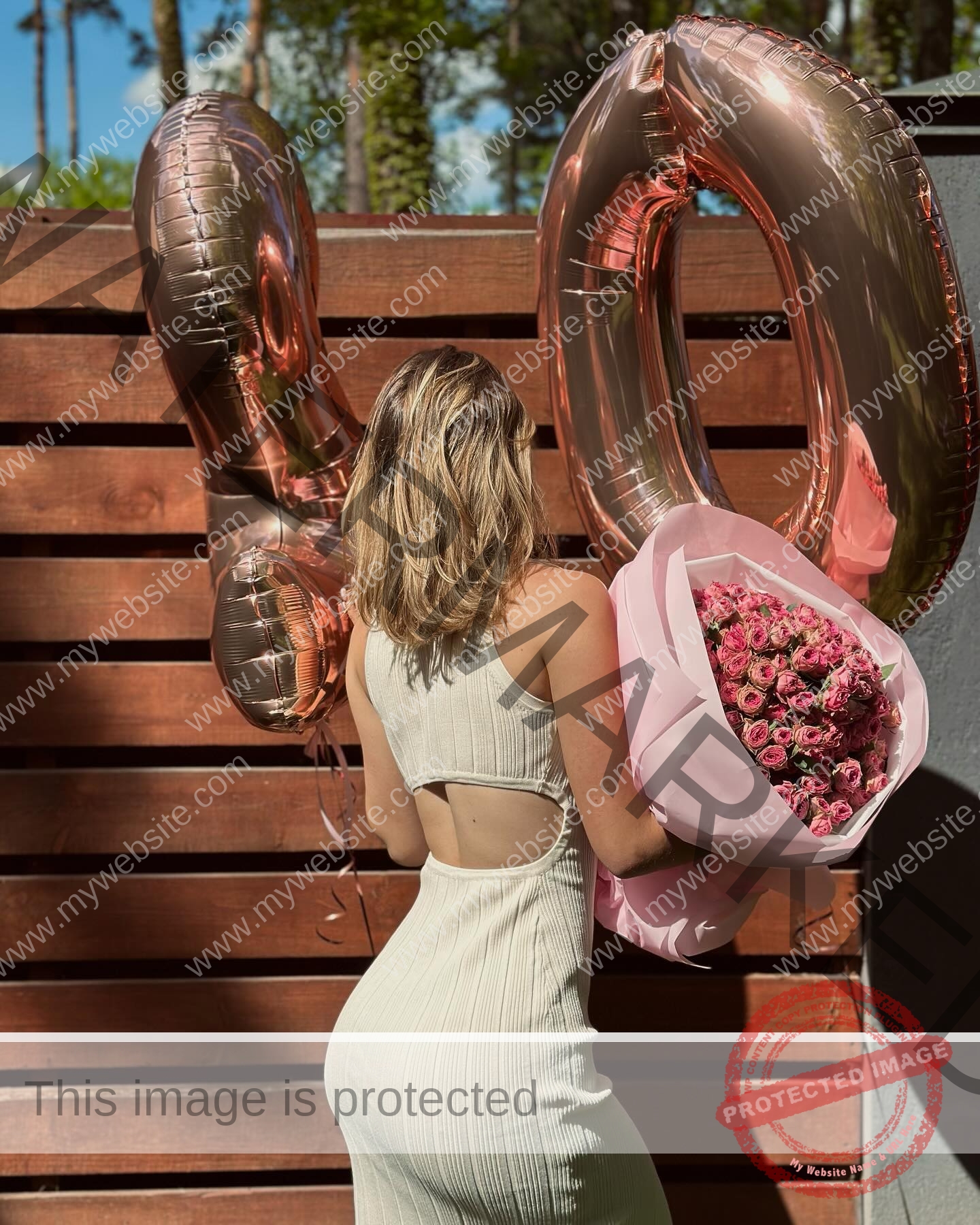 daria-polyanskaya-ukraine-polyanska.ya-x-08584 Daria-Polyanskaya, track athlete from Ukraine, in a sleeveless cream dress holds pink roses and 40 balloons by a wooden fence.