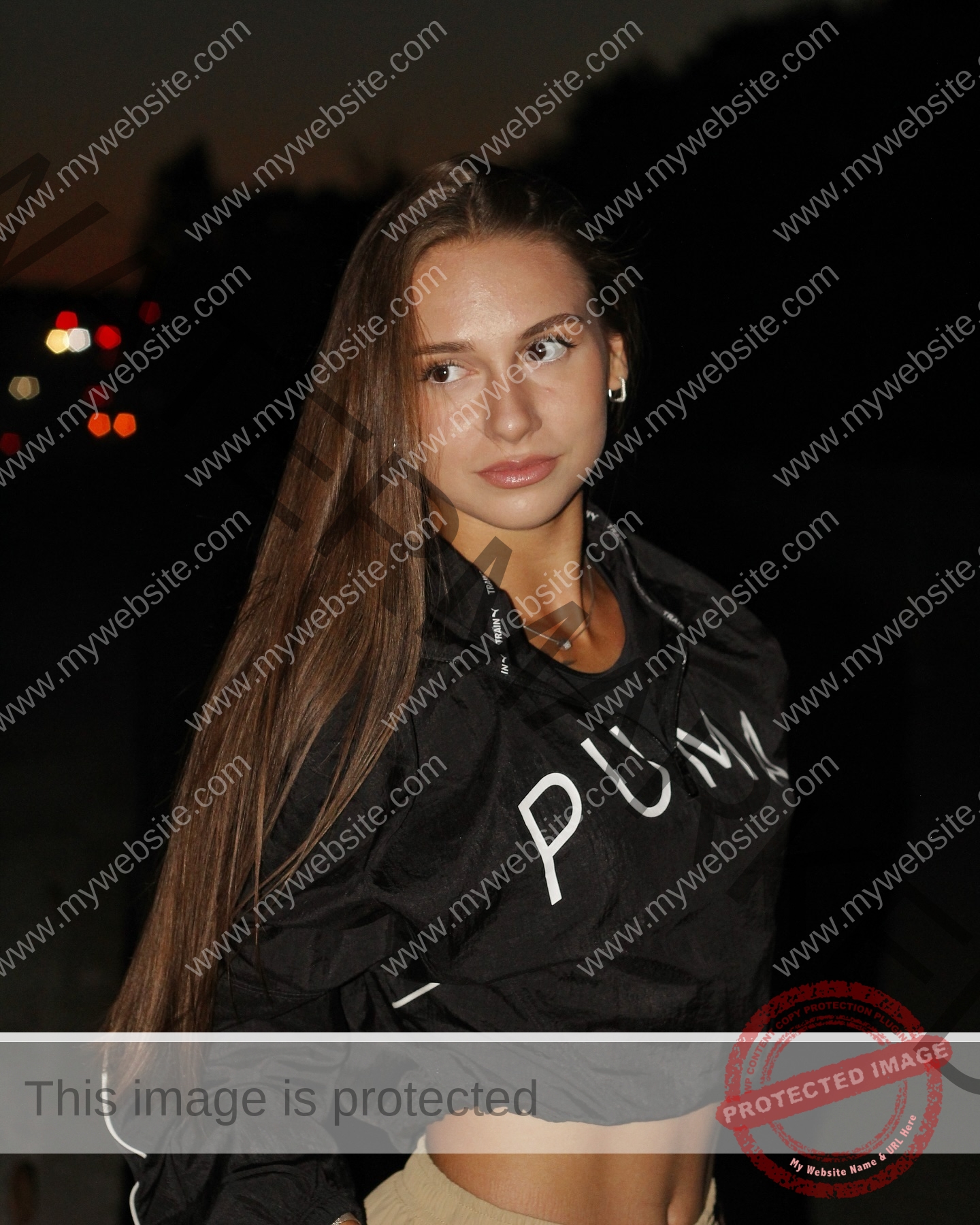 diana-honcharenka-ukraine-goncharenko_43-09843 Diana Honcharenka, track athlete from Ukraine, stands at dusk in a black PUMA jacket and beige pants, looking to the side.