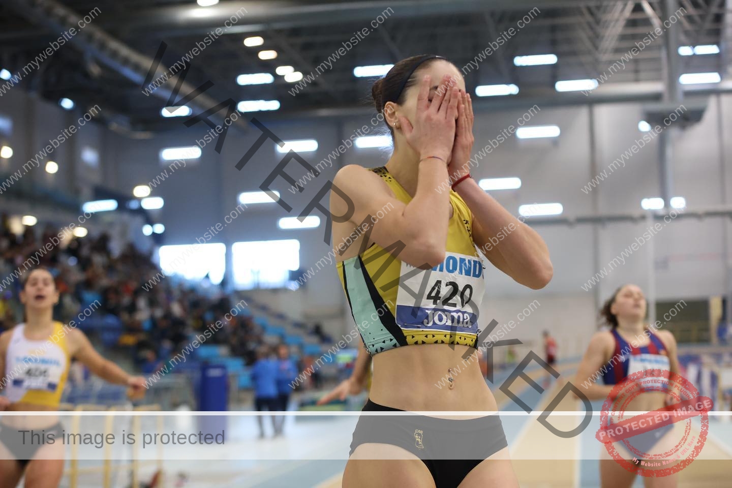 laura-castillo-spain-laura_c.i_-3264 Laura Castillo A female track and field athlete from Spain, Laura Castillo, emotional with hands on face after race on indoor track.
