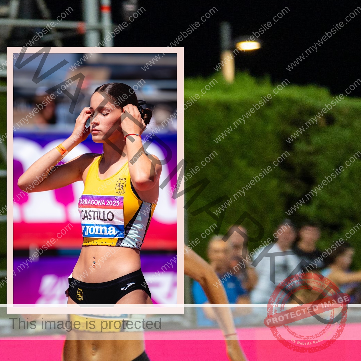 laura-castillo-spain-laura_c.i_-3301 Laura Castillo Spanish track and field athlete Laura Castillo stands with eyes closed, hands on head at a track event, background blurred.