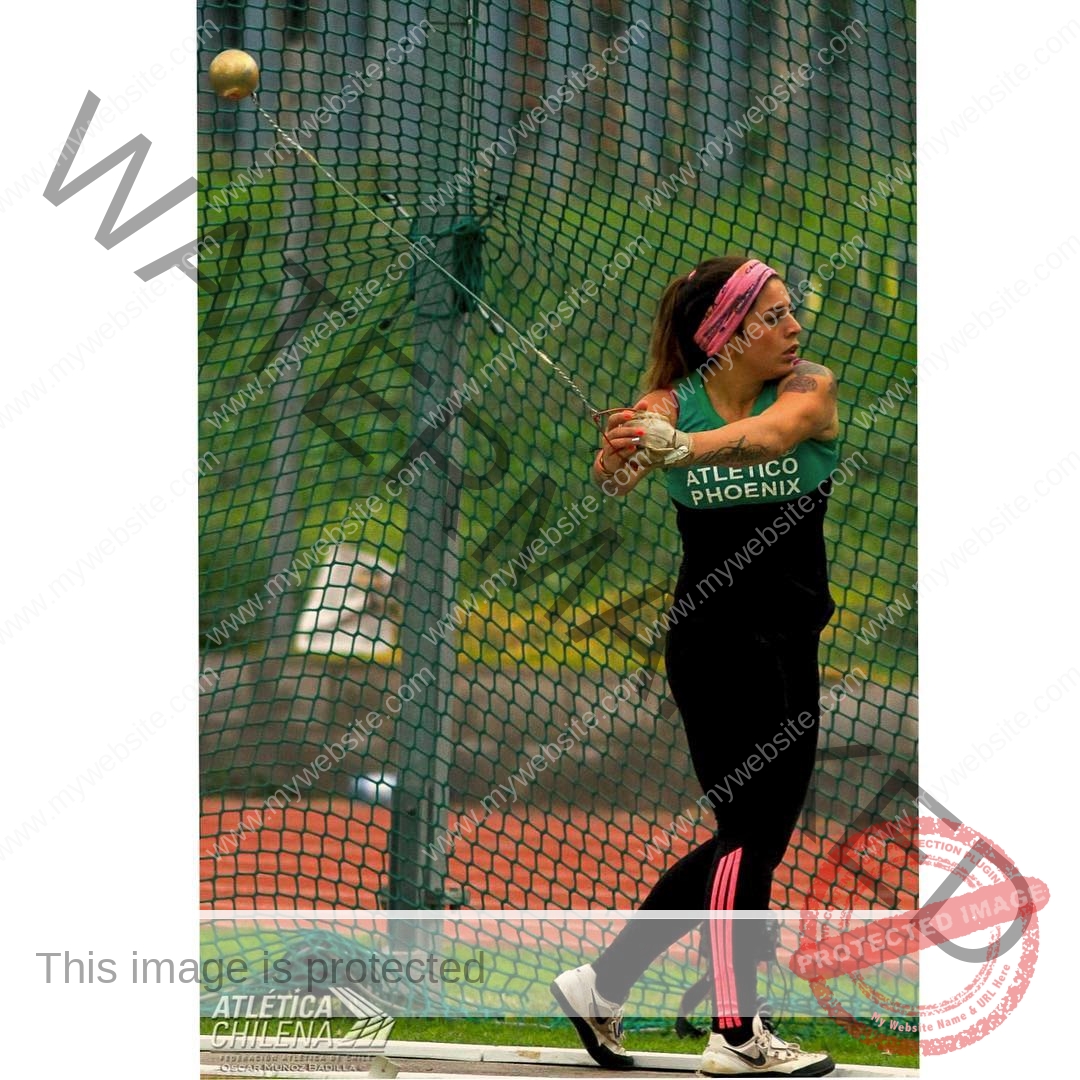 mariana walker-childe-marianawalker_-1664 Mariana Walker, hammer thrower from Chile, wears a pink headband and black athletic gear, mid-swing in the hammer cage at competition.