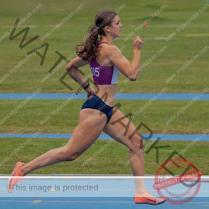 Marti Bonaudi Marti Bonaudi, a Uruguayan track athlete, sprints on a blue track in maroon sports bra, navy shorts, orange shoes, bib 315.