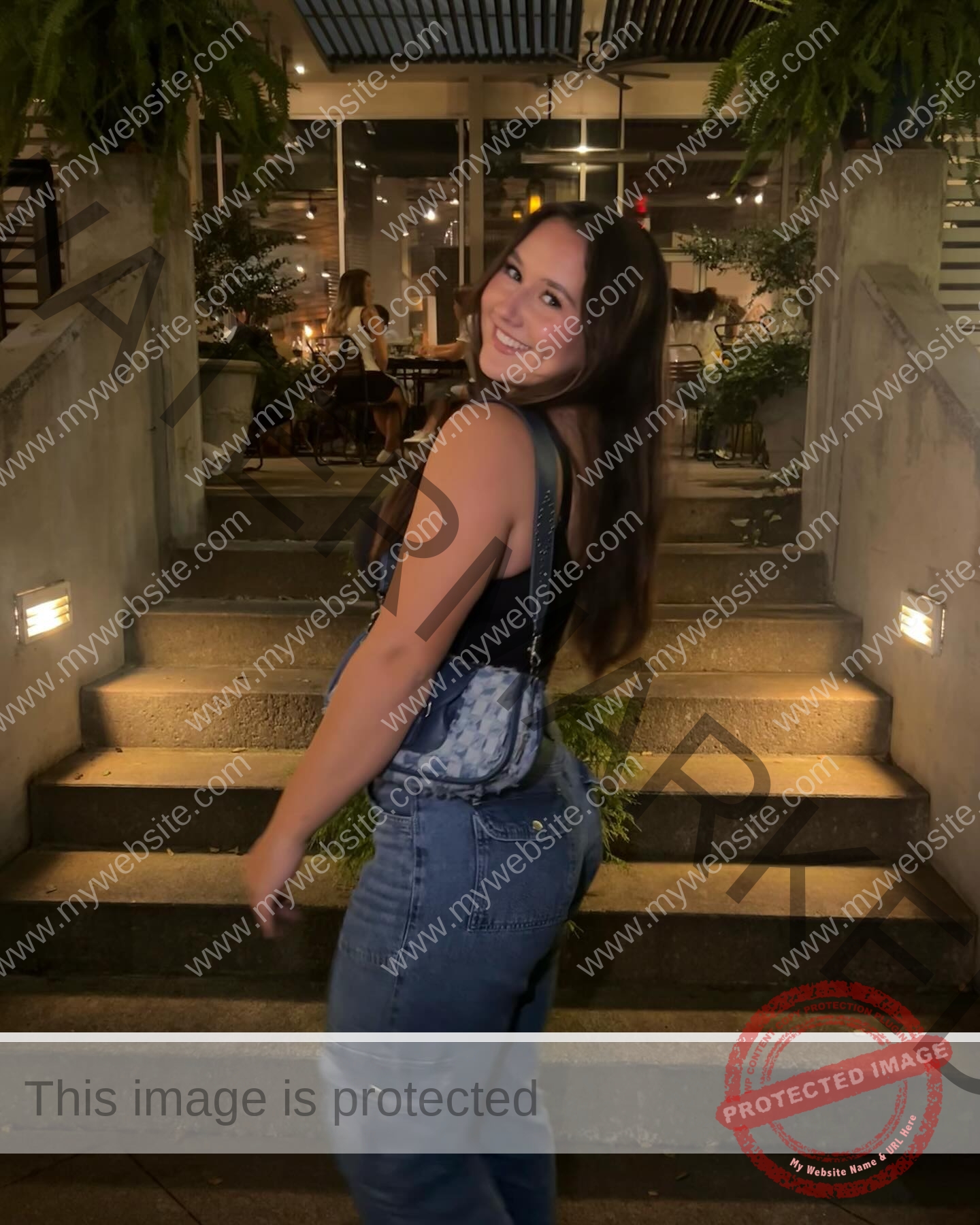 rosa-gergely-wake-forest-th-ro_gerg-08300 Rosa Gergely Rosa Gergely, a young woman with long brown hair, smiles on outdoor steps at night in a black top and jeans, purse in hand.