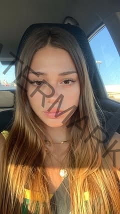 565512135_18068254370591413_6470192891788907156_n Norma Grezio, track and field star from Italy, sits in a car seat with long light brown hair, gold necklace, sunlit face and hair.