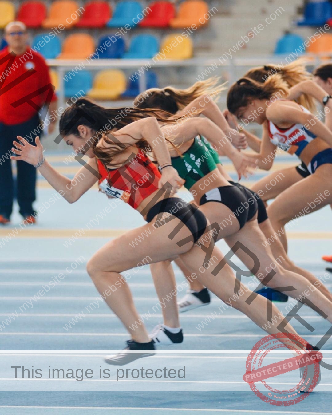 claudia-camacho-spain-clauudiacamacho-1462 Claudia Camacho, track and field star from Spain sprints in sportswear from the starting line on an indoor track, mid-stride.