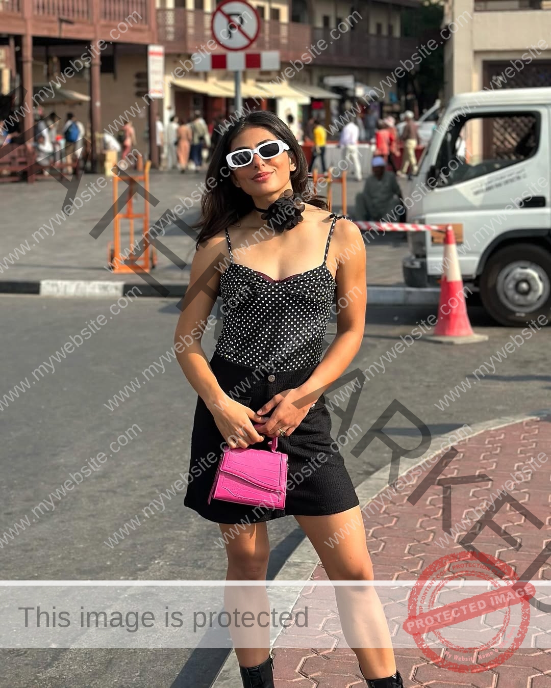 niharika-vashisht-india-niharika.vashhisht-05838 Niharika Vashisht, track and field star from India, wears white sunglasses, polka-dot top, black skirt, and boots with a pink bag.