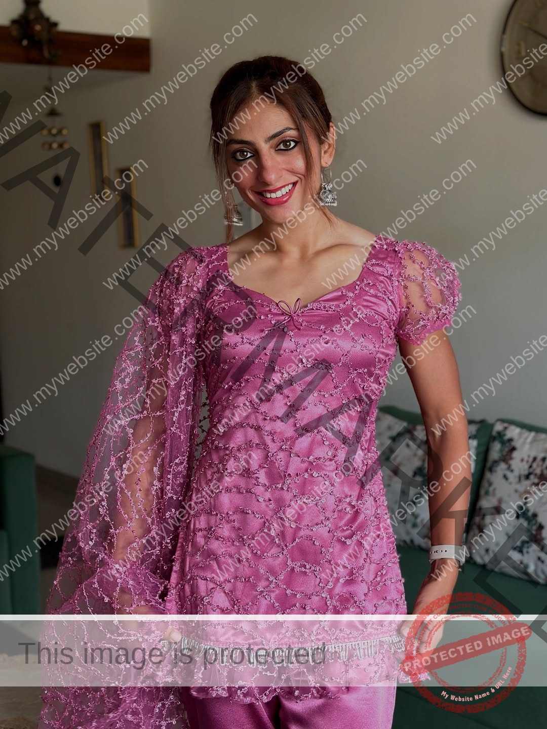 niharika-vashisht-india-niharika.vashhisht-06244 Niharika Vashisht, track and field star from India, stands indoors in a pink embroidered outfit with sheer sleeves and matching dupatta.