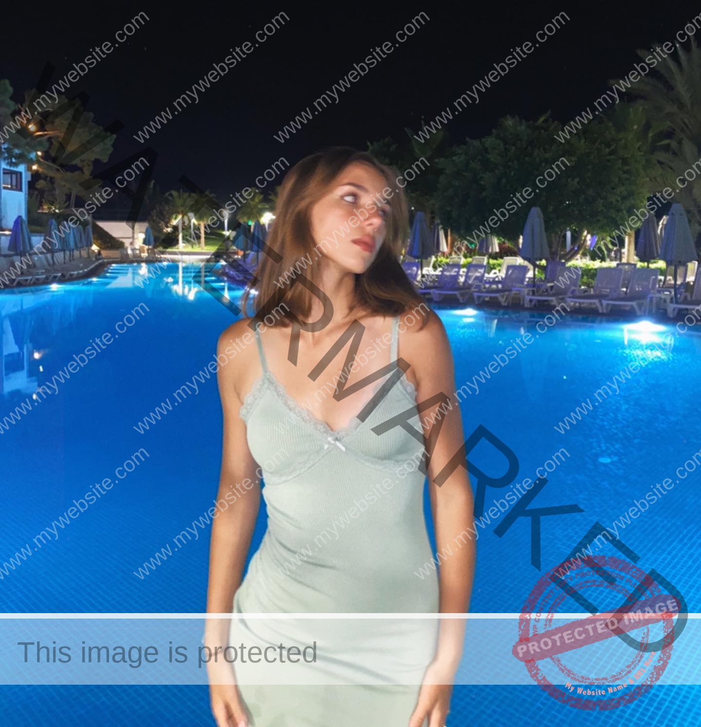 viktoriya-antipova-russia-viichkaaaaa-03524 Viktoriya Antipova, track and field star from Russia, stands in a light green dress by a lit pool at night with palms behind.