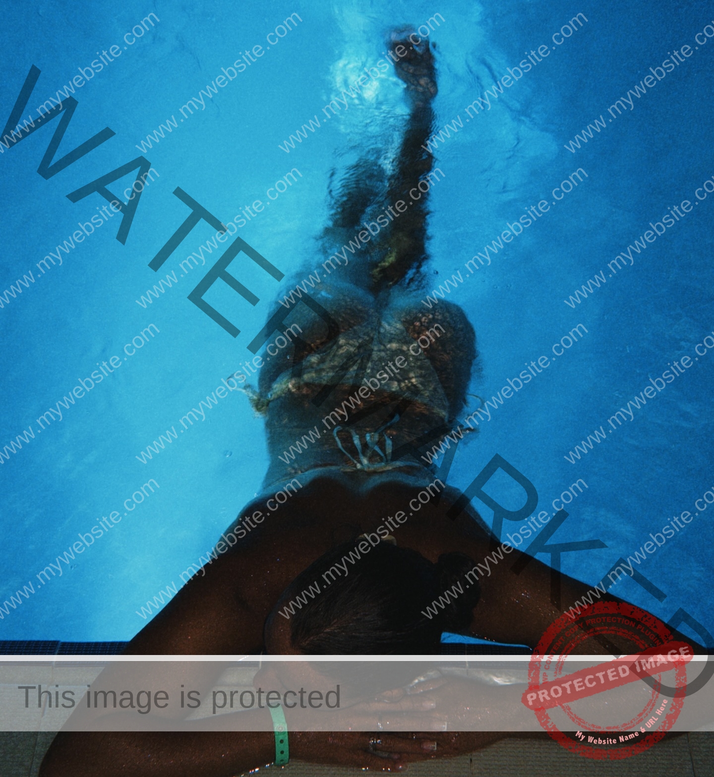 viktoriya-antipova-russia-viichkaaaaa-03758 Viktoriya Antapova, track and field star from Russia, lies face-down at a pool edge in a bikini; deep blue lighting fills the pool.